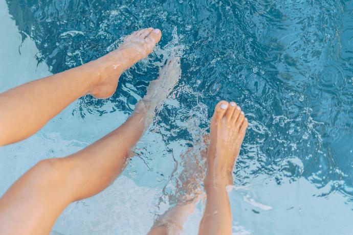 persons feet on water